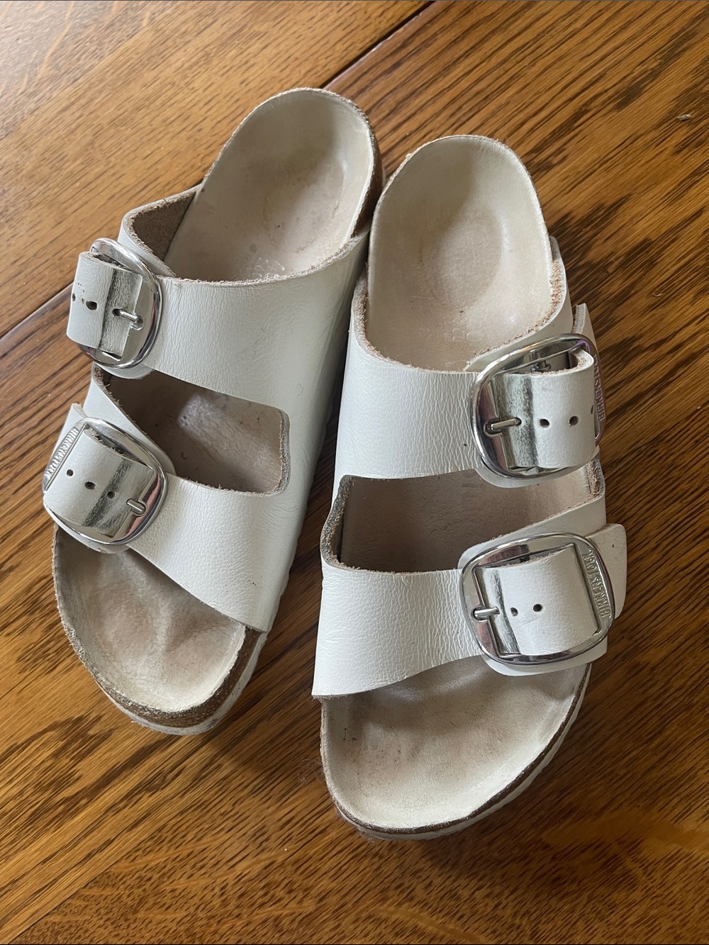 Birkenstock White Arizona Two-Strap Sandals with Silver Buckles